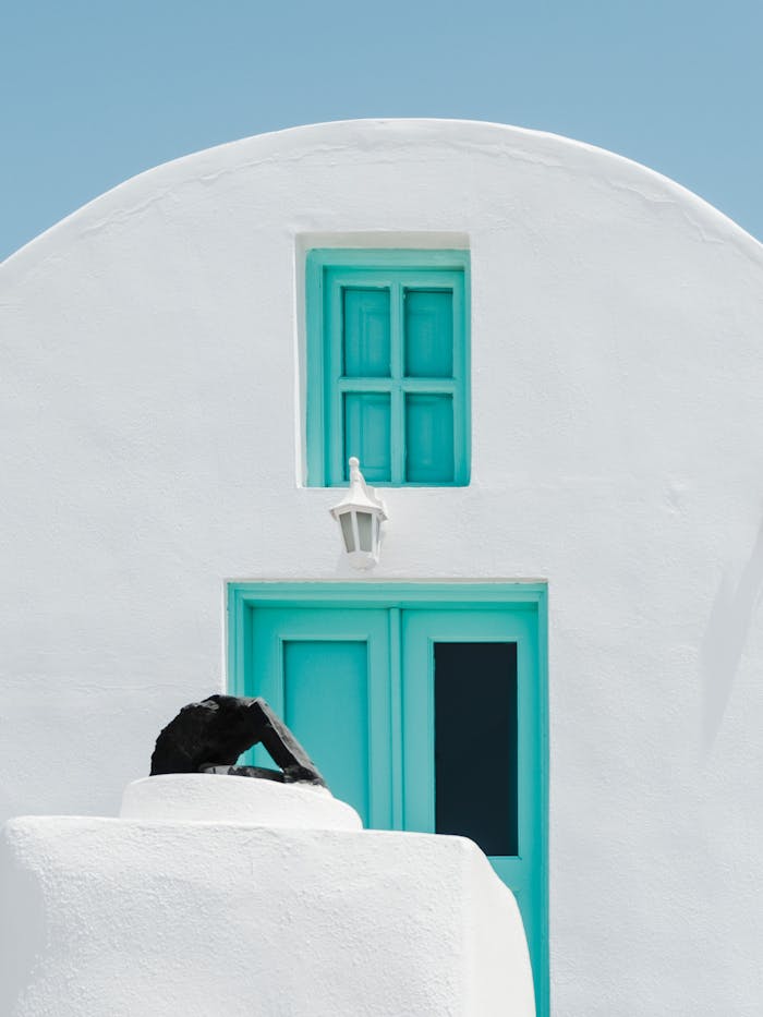 pexels photo 9464793 2 Minimalist Cycladic architecture featuring a white wall and blue door, capturing serene simplicity.